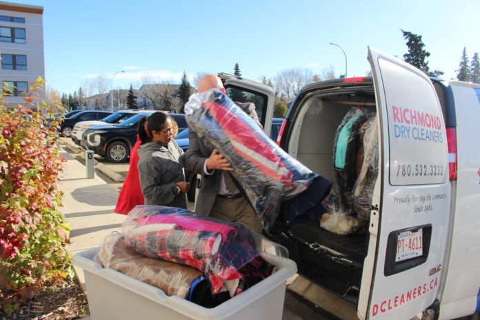 Drycleaning unloaded at the Odyssey house (Photo: Ethan Montague mygrandeprairienow.com staff)